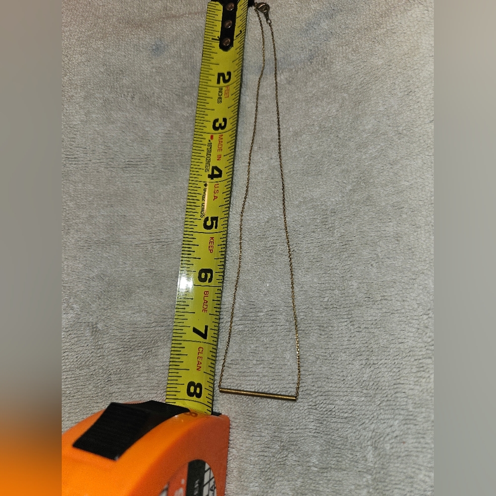 GOLDTONE SLIDING TUBE HANGING FROM A GOLD CHAIN. SLEEK PIECE. PICS 📸 - Picture 2 of 3